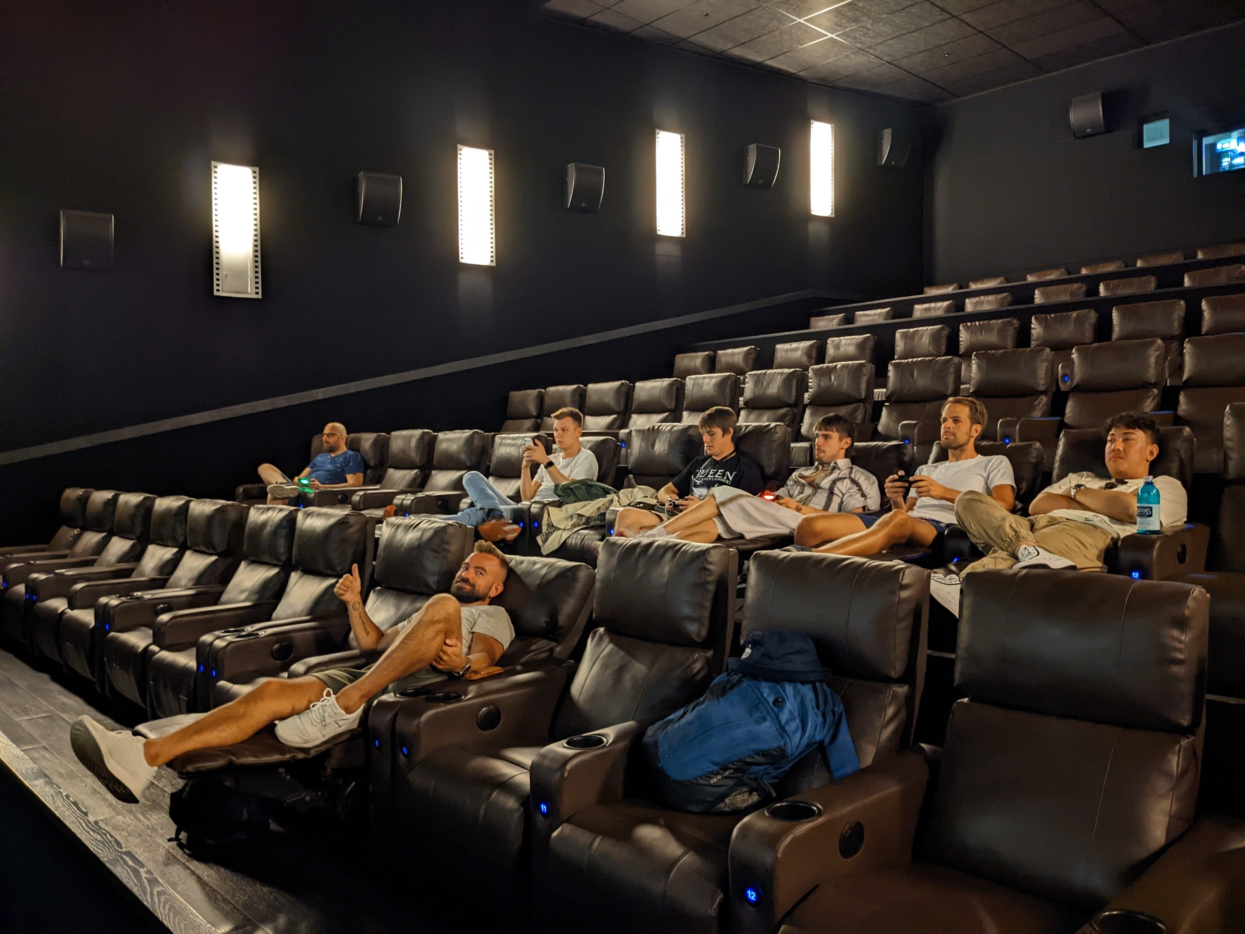 The team in deep focus while playing some games on the cinema screen.
